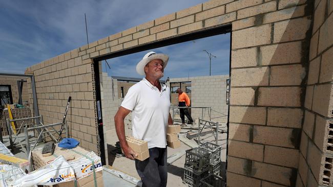 Homegroup tradies John Inwards (closest) and Perry Albon at on site a Alkimos Beach. in WA Picture: Colin Murty