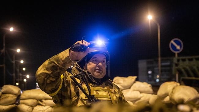 A volunteer reservist mans a a barricade close to the eastern frontline in Kyiv on Saturday. Picture: Getty Images