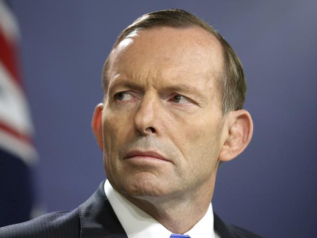 FILE - In this Sept. 19, 2014, file photo, former Australian Prime Minister Tony Abbott speaks during a press conference, in Sydney. Australiaâ€™s prime minister Friday urged restraint in the same-sex marriage debate after Abbott said he was head-butted by a gay rights advocate while walking in a city street. (AP Photo/Rick Rycroft, File)