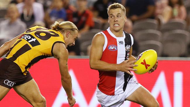 St Kilda’s Jack Lonie evades Hawthorn’s James Worpel in Friday night’s AFLX. Picture: Michael Klein