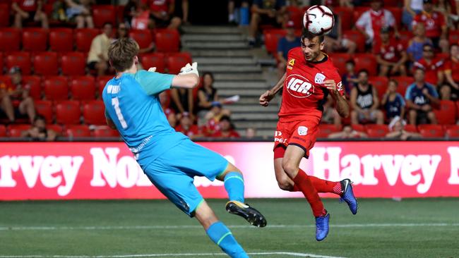 Adelaide United winger Nikola Mileusnic heads home a stoppage-time winner against Brisbane Roar earlier this A-League season. Picture: AAP Image/Kelly Barnes