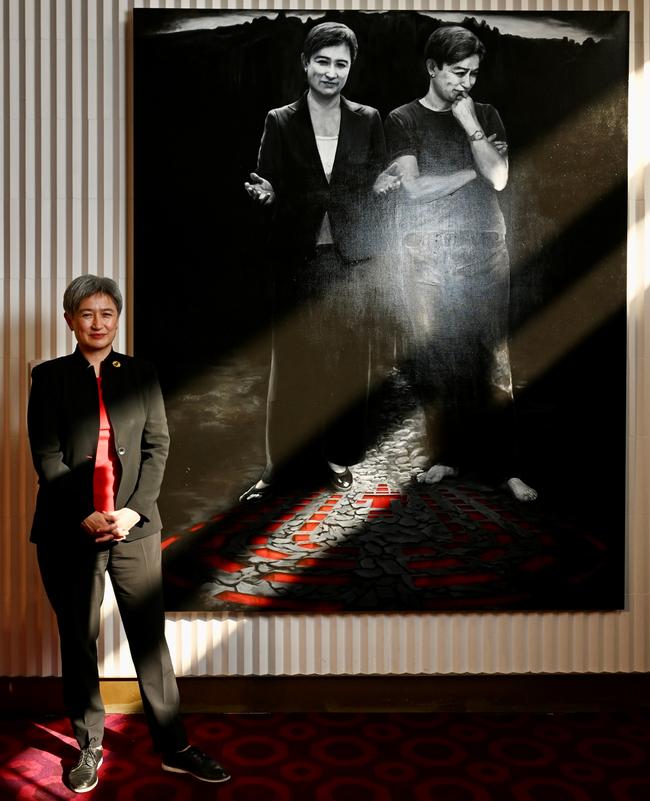 Foreign Minister Penny Wong unveiling her portrait titled The Senator and Ma, by artist Tianli Zu, at the Festival Theatre foyer in Adelaide. Picture: Naomi Jellicoe