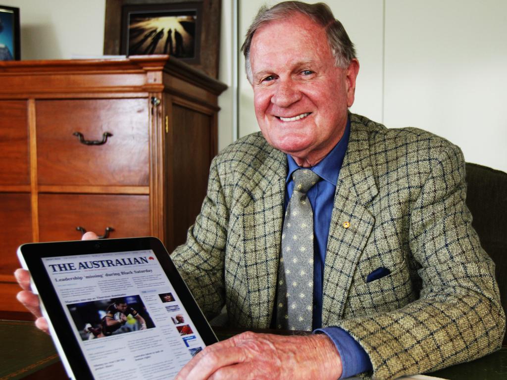 Former News Limited executive Ken Cowley, now RM Williams chairman, who was instumential in starting their national newspaper The Australian, with  a copy of the first edition of the newspaper and the first ever online edition on new Apple iPad application to be launched tomorrow, in his office in Sydney.