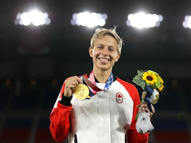 YOKOHAMA, JAPAN - AUGUST 06: Gold medalist Quinn #5 of Team Canada poses with her gold medal during the Women's Football Competition Medal Ceremony on day fourteen of the Tokyo 2020 Olympic Games at International Stadium Yokohama on August 06, 2021 in Yokohama, Kanagawa, Japan. (Photo by Naomi Baker/Getty Images)