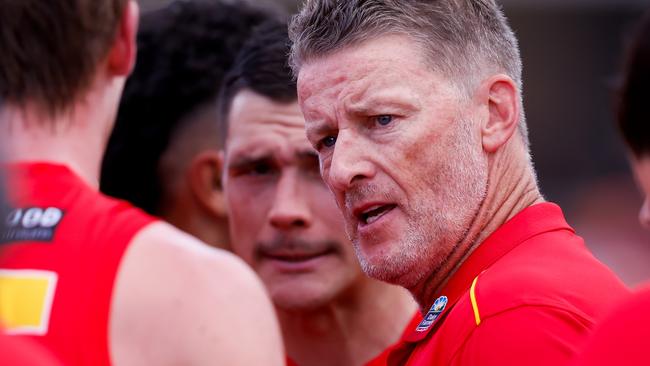 GOLD COAST, AUSTRALIA - MARCH 09: Damien Hardwick, Senior Coach of the Suns addresses his players at quarter time during the 2024 AFL Opening Round match between the Gold Coast SUNS and the Richmond Tigers at People First Stadium on March 09, 2024 in Gold Coast, Australia. (Photo by Dylan Burns/AFL Photos via Getty Images)