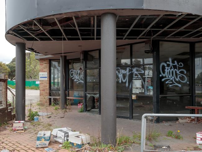 Original Joes in Heathmont is looking like a bomb site, 15 months after it burnt down. There's broken windows, no safety fencing and heaps of rubbish on site. It is pictured on Tuesday 25th September, 2018.