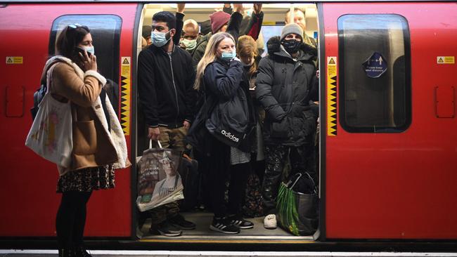 Commuters ride a tube train at Stratford underground station in east London last week. Picture: AFP