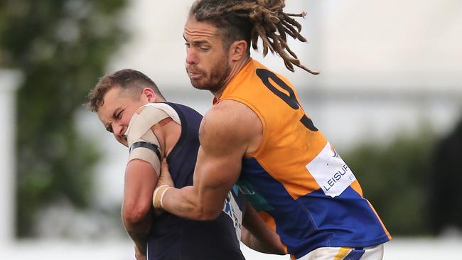 Golden Square’s Jack Geary tackles an Eaglehawk player last season. Picture Yuri Kouzmin