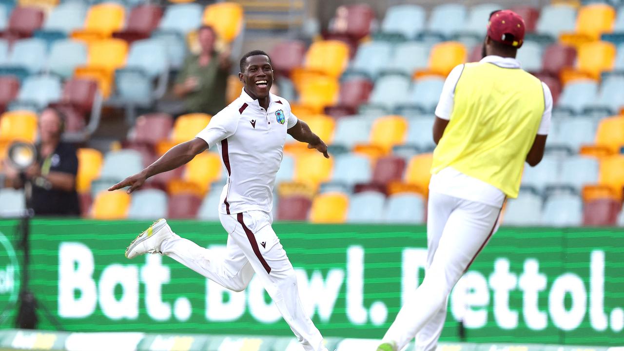 Shamar Joseph of the West Indies did a lap around the Gabba despite his injured toe after taking his seventh wicket against Australia. Picture: Pat Hoelscher / AFP.