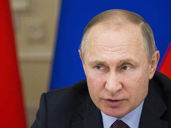 In this photo taken on Tuesday, March 6, 2018, Russian President Vladimir Putin during his trip to Yekateringburg, Russia . After hopping by helicopter back to Yekaterinburg, Russia's fourth-largest city which is a key industrial hub, Putin chaired a meeting with top officials on training industrial personnel. President Vladimir Putin has sought to reach out to voters across Russia. Putin has appealed to various social groups and traveled to many of the countryâ€™s far-flung regions, promising to bolster the economy, raise living standards and combat poverty. (AP Photo/Alexander Zemlianichenko)