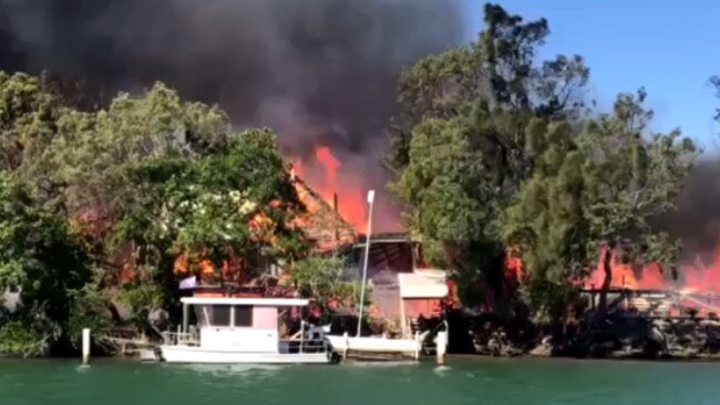 Three homes were destroyed by fire in the massive blaze at Noosa North Shore. Picture: Nine News Queensland