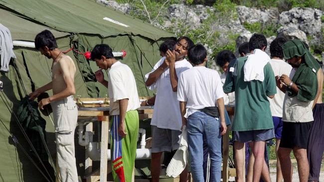 In this file photo, men shave, brush their teeth and prepare for the day at a refugee camp on the Island of Nauru. Picture: Rick Rycroft