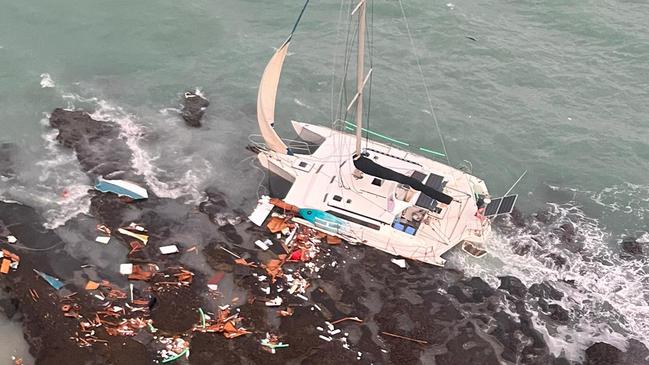 Rescue300 responded to a Trimaran shipwrecked on rocks on South Barron Island. Picture: CapRescue