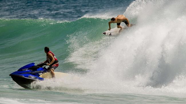 Surfers getting in on the action. Picture: Jerad Williams