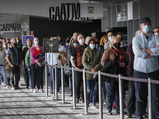 Queues build at the Melbourne Exhibition Centre vaccine hub. Picture: David Caird