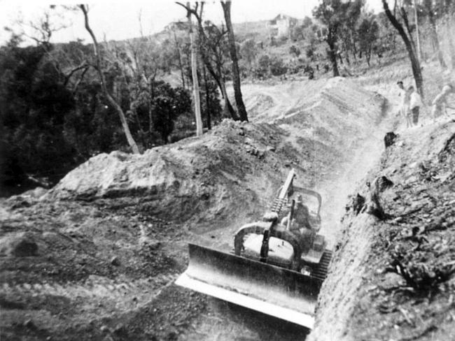 A bulldozer making the anti-tank trench between Bungan and Winji Jimmi Bay. Picture Northern Beaches Library