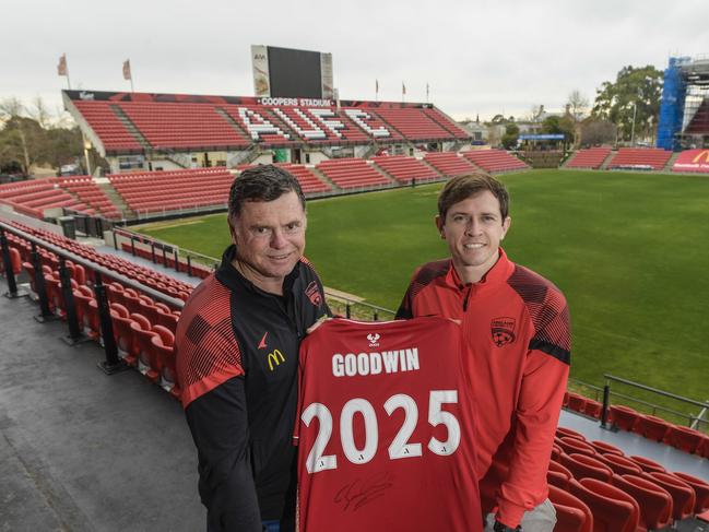 Craig Goodwin celebrates his Adelaide United three-year deal with Reds coach Carl Veart. Picture: Roy VanDerVegt