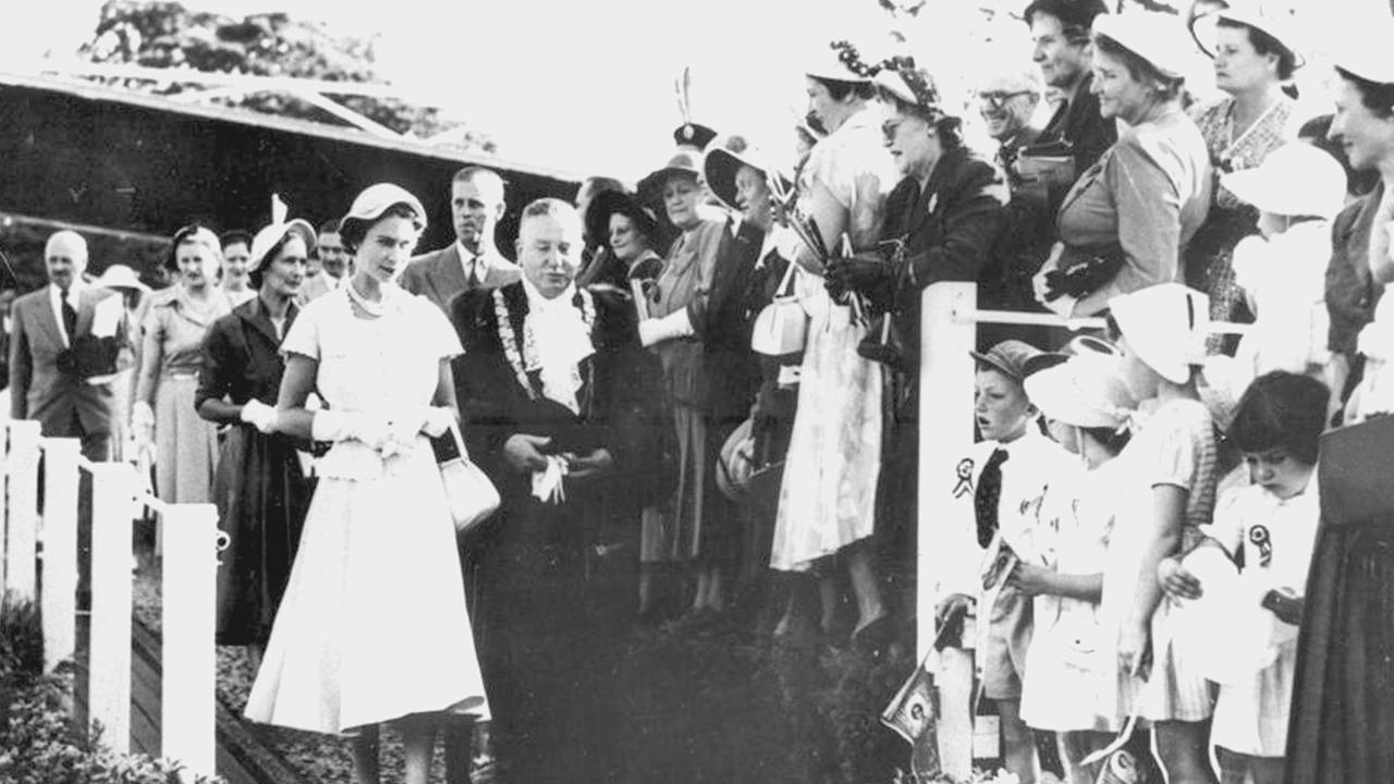 ROYAL PROCESSION: H.R.H. Queen Elizabeth II, Mayor of Toowoomba, Curly Anderson make their way down from the reception dais at Queen’s Park, followed by Prince Philip, Mrs. Anderson and the rest of the official party on March 11, 1954, as part of their Royal Tour. Approximately 100,000 people were in Toowoomba that day, hoping to catch a glimpse of their new monarch. Photo: Contributed