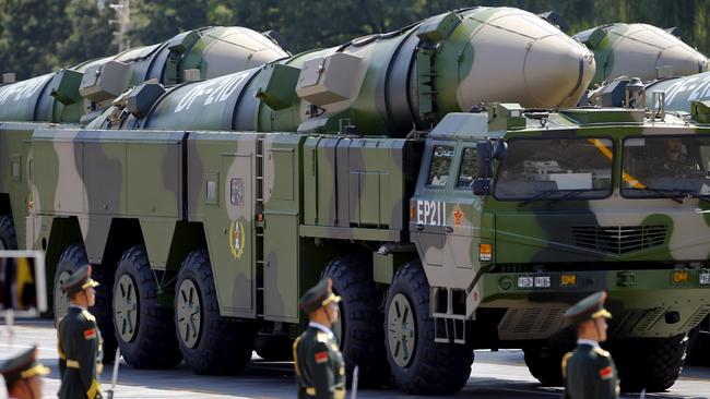 Military vehicles carrying Chinese DF-21D ballistic missiles in Tiananmen Square. Picture: Reuters