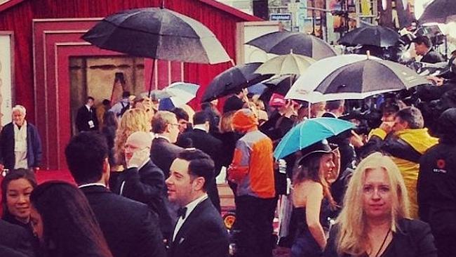 Melissa Doyle posted this picture of a sea of umbrellas as media gather on the red carpet