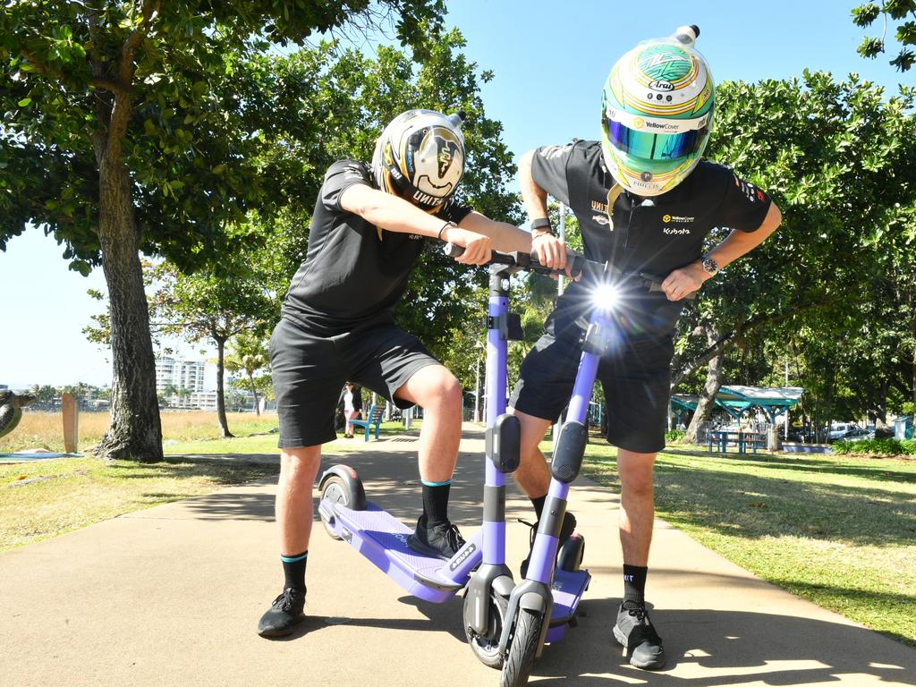 Matt Stone Racing duo Jake Kostecki and Zane Goddard ride Beam scooters on The Strand. Picture: Matthew Elkerton