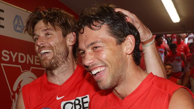 SYDNEY, AUSTRALIA - MAY 04: Oliver Florent and Dane Rampe of the Swans celebrate victory as they walk down the race during the round eight AFL match between Sydney Swans and Greater Western Sydney Giants at SCG, on May 04, 2024, in Sydney, Australia. (Photo by Mark Metcalfe/AFL Photos/via Getty Images )