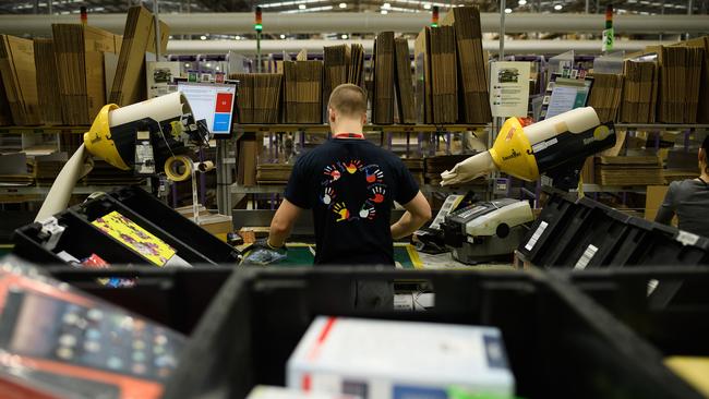 A member of staff packs items for delivery at the Amazon Fulfilment centre in Peterborough, UK. Picture: Leon Neal/Getty Images