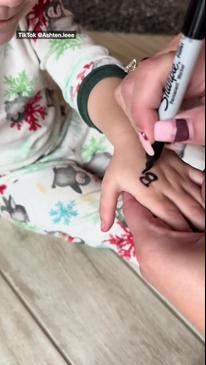 Mum writes name on child’s hand before hurricane hits