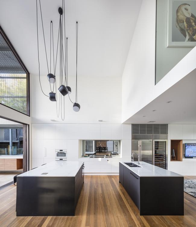 The kitchen feels much larger than it is thanks to a generous void and careful management of natural light.