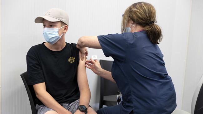 Arley Kluck, 14, gets his second Pfizer vaccination in Ipswich on Wednesday morning. NCA NewsWire / Sarah Marshall