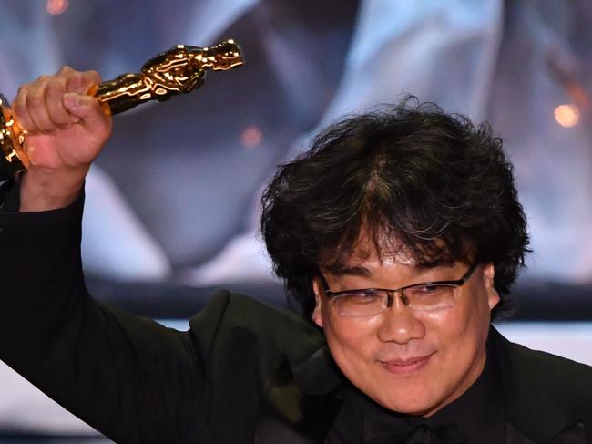 South Korean director Bong Joon-ho accepts the award for Best International Feature Film for "Parasite" during the 92nd Oscars at the Dolby Theatre in Hollywood, California on February 9, 2020. (Photo by Mark RALSTON / AFP)