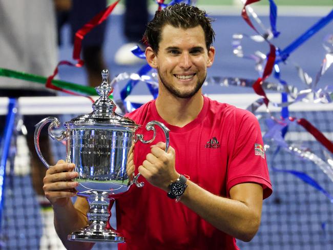 NEW YORK, NEW YORK - SEPTEMBER 13: Dominic Thiem of Austria celebrates with the championship trophy after winning in a tie-breaker during his Men's Singles final match against Alexander Zverev of Germany on Day Fourteen of the 2020 US Open at the USTA Billie Jean King National Tennis Center on September 13, 2020 in the Queens borough of New York City. (Photo by Al Bello/Getty Images)