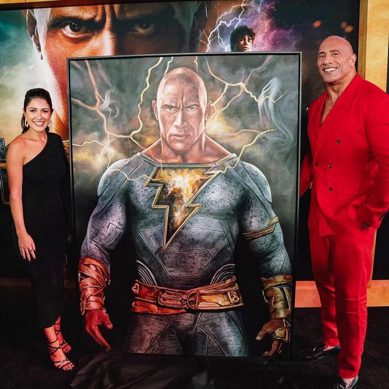 Danielle presenting the piece she created for The Rock at the world premiere of his latest movie Black Adam in New York’s Times Square. Picture: Flannery Underwood