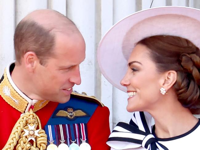 Princess Catherine and Prince William share a tender moment on the royal balcony. Picture: Getty Images