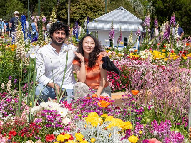 Lakh Saini and Leslie Niu enjoy the Botanic Garden display in Queens Park during the Carnival of Flowers, Sunday, September 22, 2024. Picture: Bev Lacey