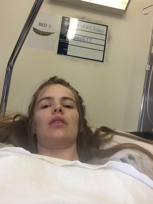 Robyn Lawley in hospital after she had the first of two strokes.