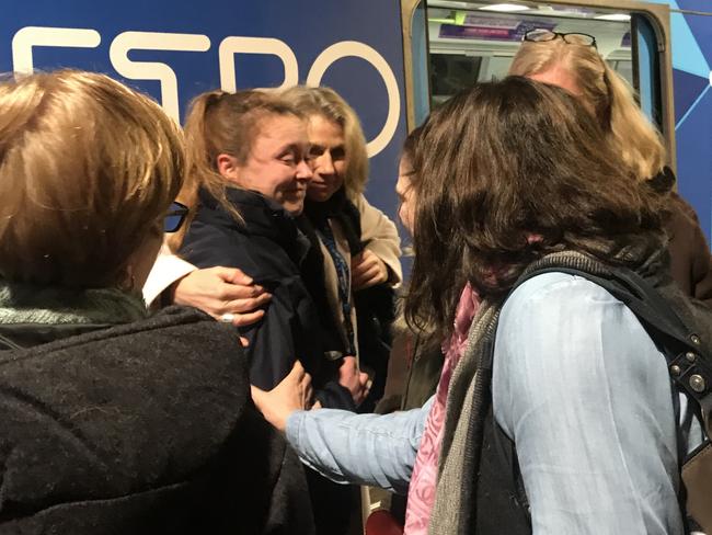 Passengers hug a Metro train driver who was overcome with emotion during this morning's peak hour commute.