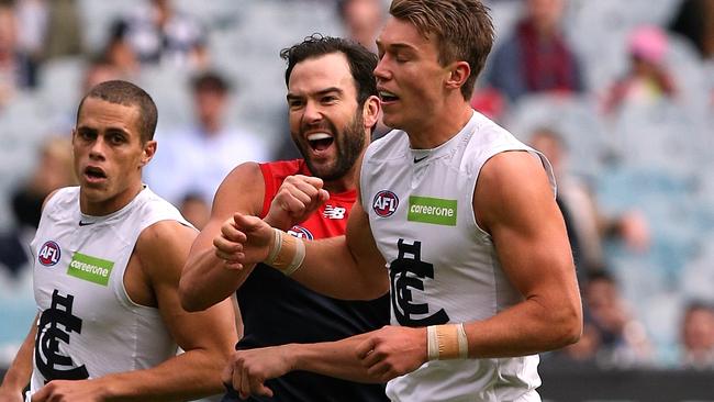 Jordan Lewis gets stuck into Patrick Cripps. Picture: Wayne Ludbey