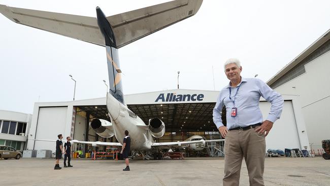 Managing director of Alliance Airlines Scott McMillan with some of his aircraft engineers at their base in Brisbane Airport. Picture: Lyndon Mechielsen