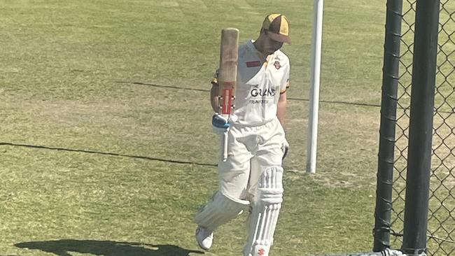 Heatherhill centurion Kristian Miller raises his bat. Pic: Tyler Lewis