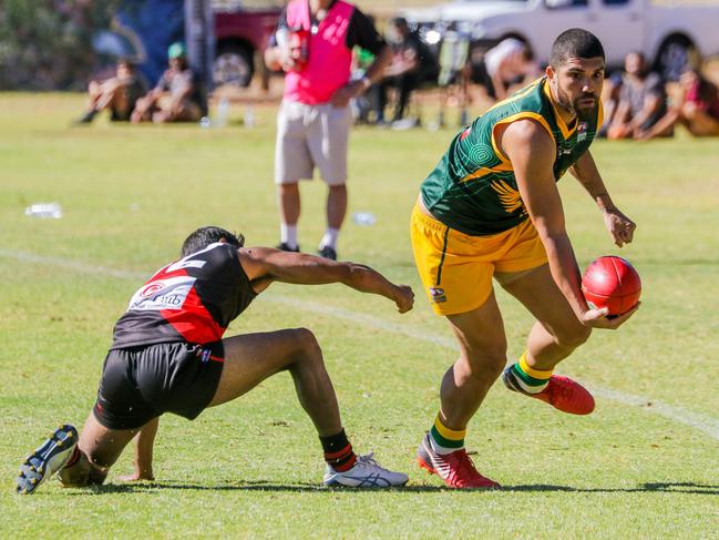 Pioneer's Curtly Hampton looks for a handball option in his side's 15-point win over Wests. Picture: Charlie Howson