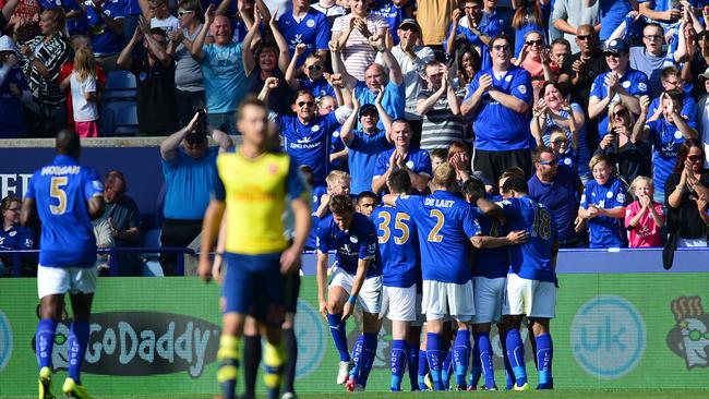 Leicester City players celebrates in front of their home crowd.