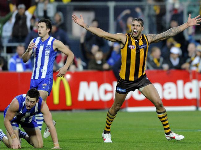 Lance Franklin of Hawthorn celebrates kicking his 13th goal against North Melbourne in 2012. (AAP Image/Julian Smith) NO ARCHIVING, EDITORIAL USE ONLY