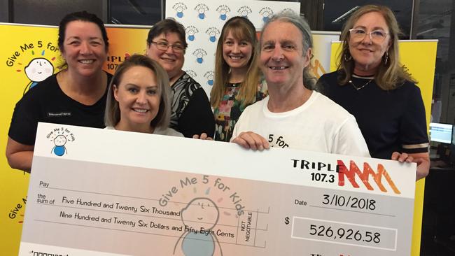 Triple M’s Al Plath and Dave Noonan, front, present the cheque for more than $500,000 to the Royal Hobart Hospital. Picture: SUPPLIED