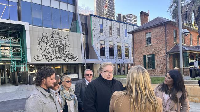 Solicitor Aaron Kernaghan and Simon Fleming's family outside court after the jury was on Tuesday ordered to return an acquittal relating to a terrorist charge. Picture: Steve Zemek/NCA Newswire.