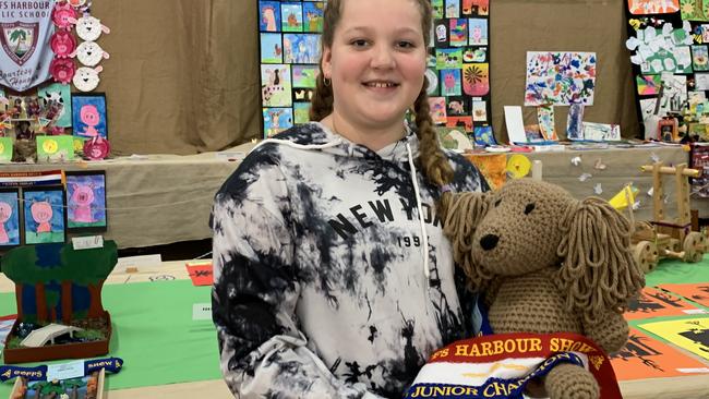 Grace Ablett proudly showing her handmade bear, intricately designed. She won an award for her incredible crochet.