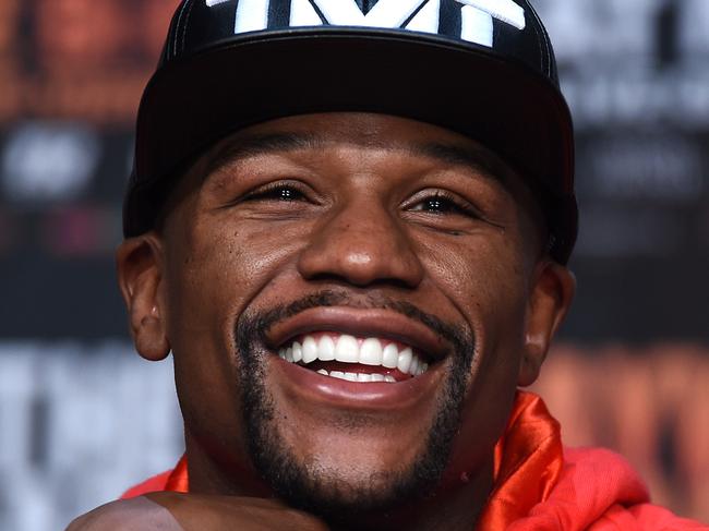 LAS VEGAS, NV - APRIL 29: WBC/WBA welterweight champion Floyd Mayweather Jr. laughs during a news conference at the KA Theatre at MGM Grand Hotel & Casino on April 29, 2015 in Las Vegas, Nevada. Mayweather will face WBO welterweight champion Manny Pacquiao in a unification bout on May 2, 2015 in Las Vegas. (Photo by Ethan Miller/Getty Images)