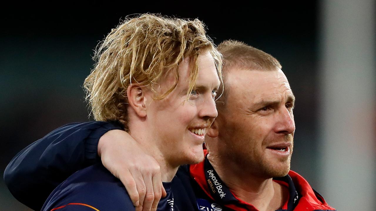 MELBOURNE, AUSTRALIA - SEPTEMBER 09: Clayton Oliver of the Demons and Simon Goodwin, Senior Coach of the Demons are seen during the 2022 AFL Second Semi Final match between the Melbourne Demons and the Brisbane Lions at the Melbourne Cricket Ground on September 9, 2022 in Melbourne, Australia. (Photo by Dylan Burns/AFL Photos via Getty Images)