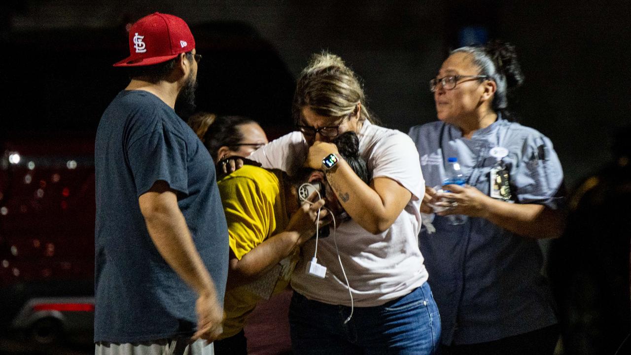 A family grieves following the mass shooting at Robb Elementary School in Uvalde, Texas. Picture: Brandon Bell/Getty Images/AFP