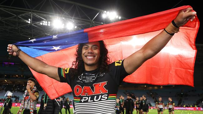 Jarome Luai of the Panthers celebrates with the Samoa flag after victory in the 2022 NRL Grand Final match between the Penrith Panthers and the Parramatta Eels.